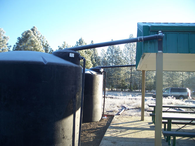 Above Ground Large Water Tank Cistern Installations Examples Inflow Pipe From Picnic Area To 2500 Gallon Tank